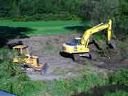 Heavy Machinery on bank of Nine Mile Creek